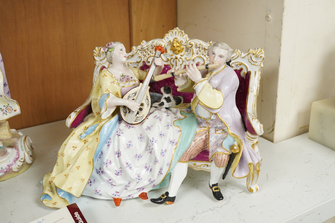 A Meissen style porcelain musical group, a figurine of a lady holding grapes and a two Derby figures of Summer and Autumn, c.1810-30, largest 24cm high